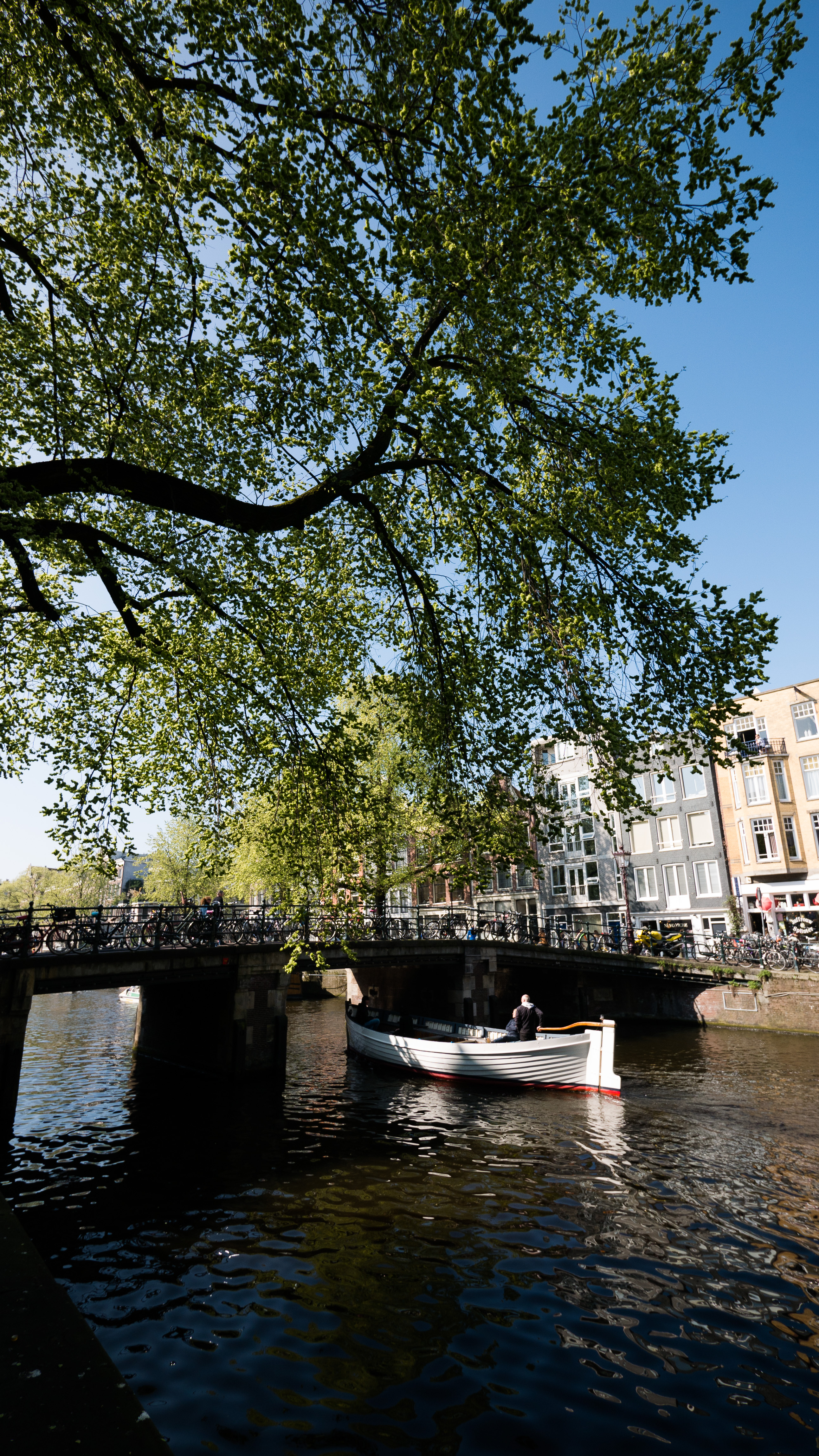 Boat under the bridge in Jordaan