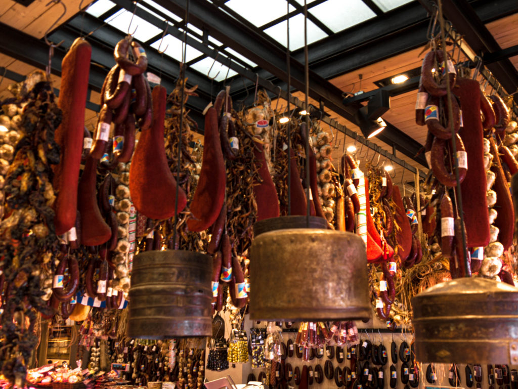 Cured emat and garlic hanging from ceiling