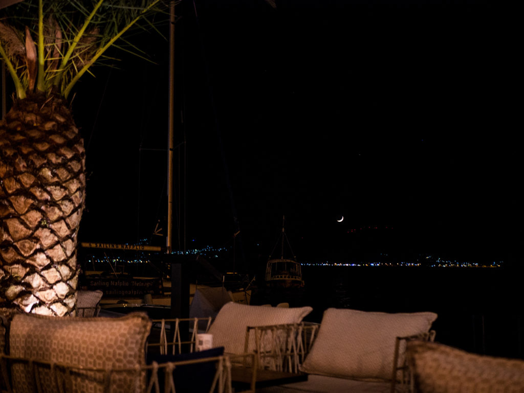 Sofas looking towards the ocean and moon in Nafplio